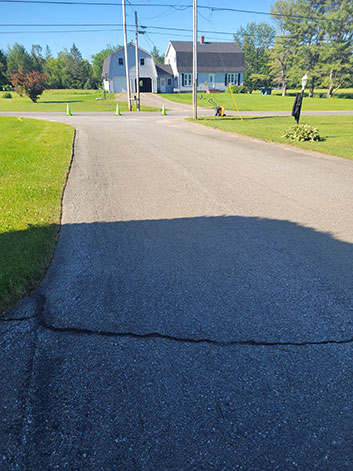 Cracked road with sunny weather