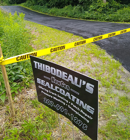 Caution tape in Sealcoating road